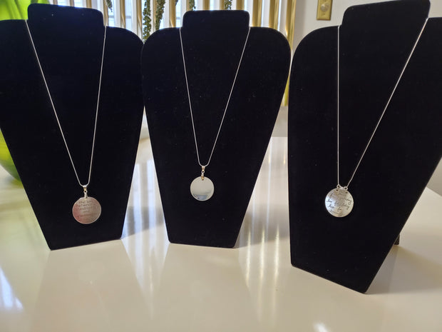 Sterling silver necklaces and the pendants are silver pieces and the middle pendant is stainless steel