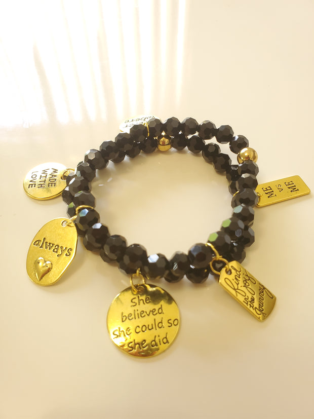 2 Black facet bracelets with charms, stretch.
